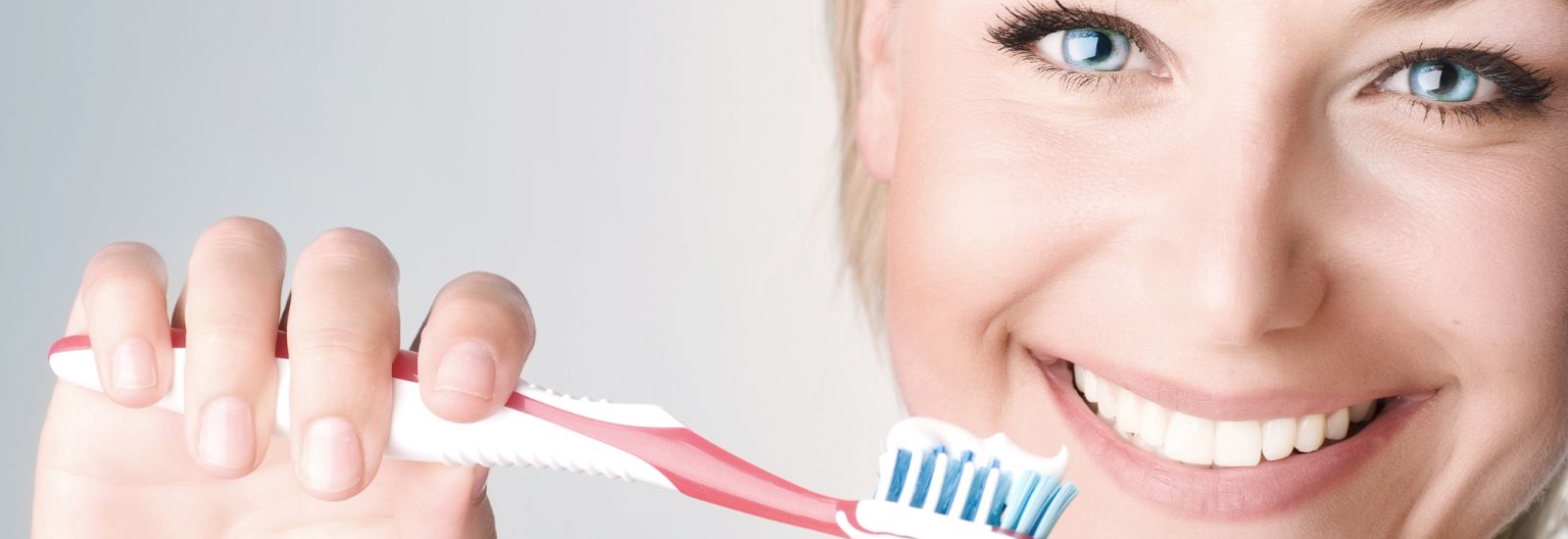 Beautiful woman holding a tooth brush